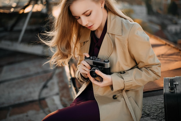 Girl with camera on the roof