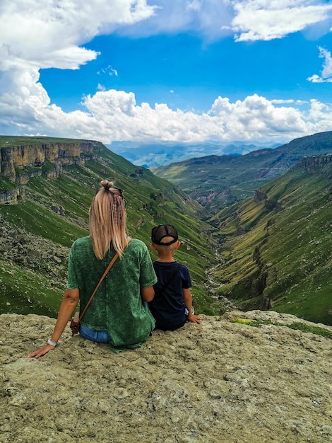 A girl with a child on the background of the Khunzakh valley Khunzakh waterfalls Dagestan 2021