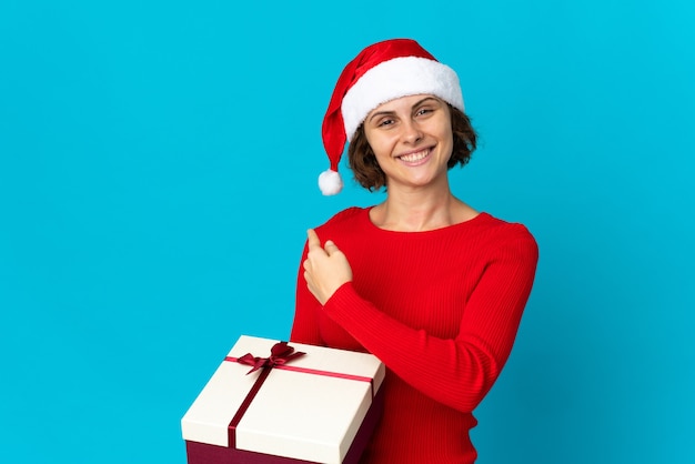 Girl with Christmas hat on a blue background