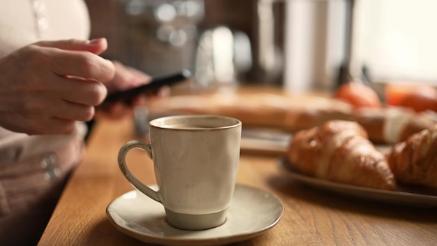 Girl with coffee cappuccino and smartphone