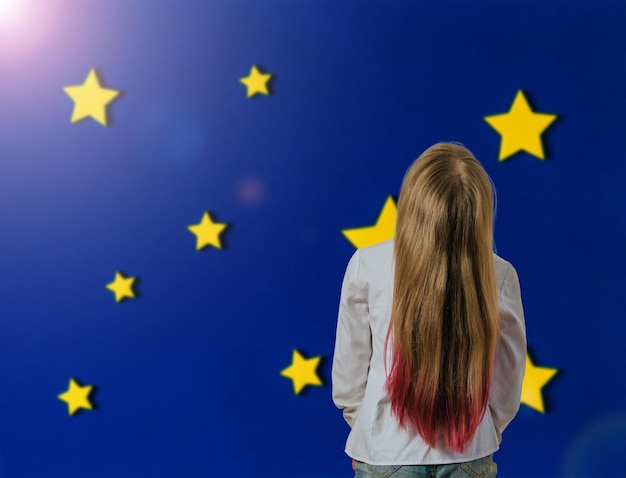 A girl with dyed hair on a blue background with stars