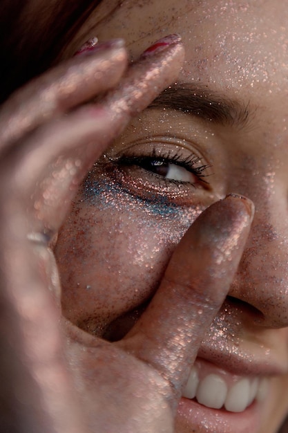 Girl with glitter on her face studio portraits