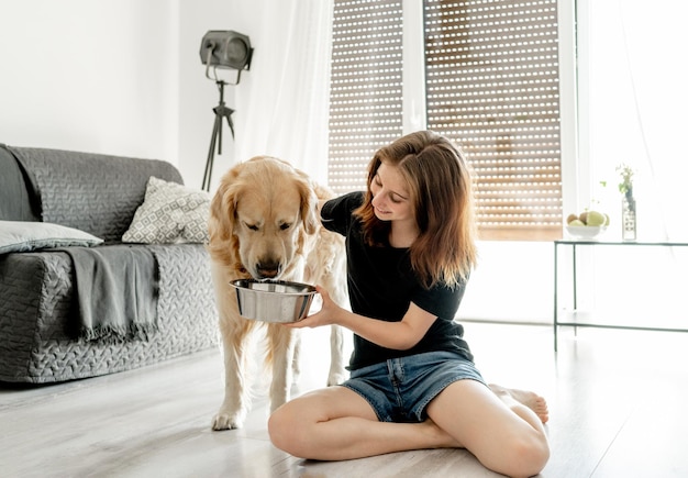 Girl with golden retriever dog