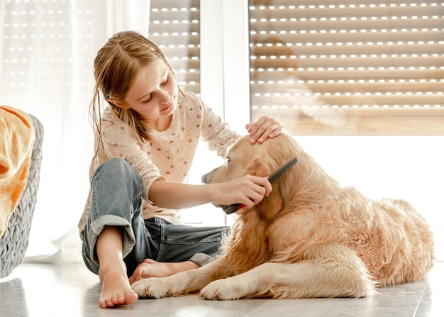 Girl with golden retriever dog