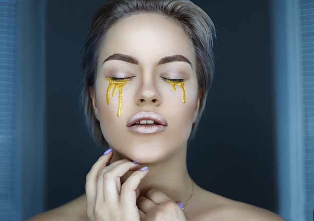 Girl with golden tears, face, make up, crying, yellow tears, spoils, short hair,