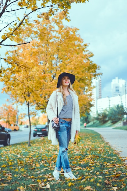 Girl with legs crossed in a park