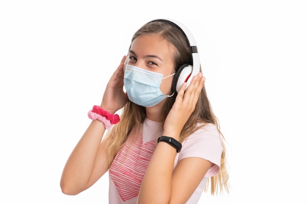 Girl with mask and helmets listening to music white background