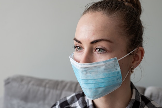 Girl with medical mask to protect her from virus