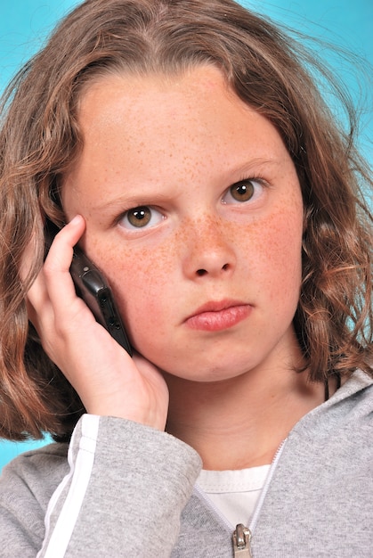 A girl with a mobile phone in her hand