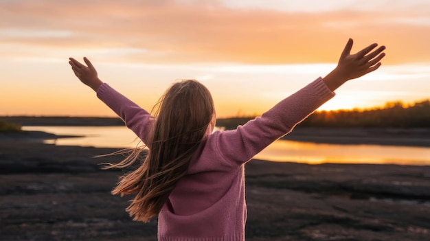 Photo girl with outstretched arms welcoming the sunrise with joy and hope for a new day