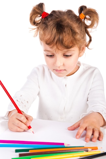 Girl with pencils isolated on a white background