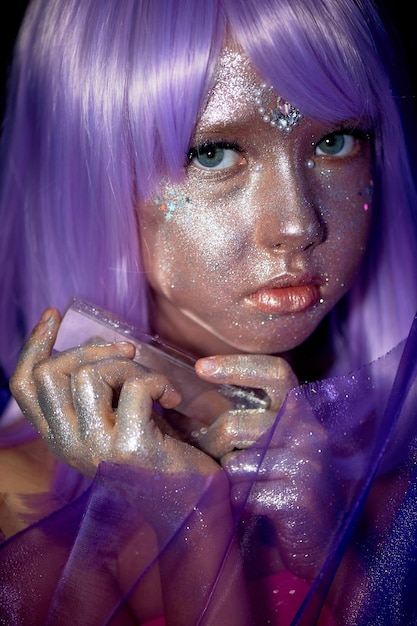 A girl with purple hair and glowing skin An alien or a fairy with glowing skin