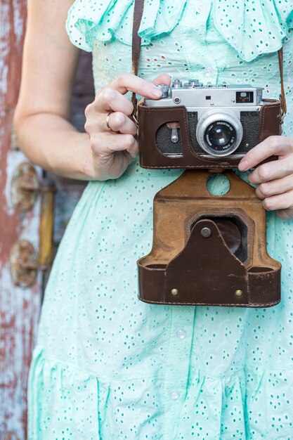 Photo girl with retro camera. vintage.