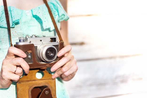 Girl with retro camera. Vintage.