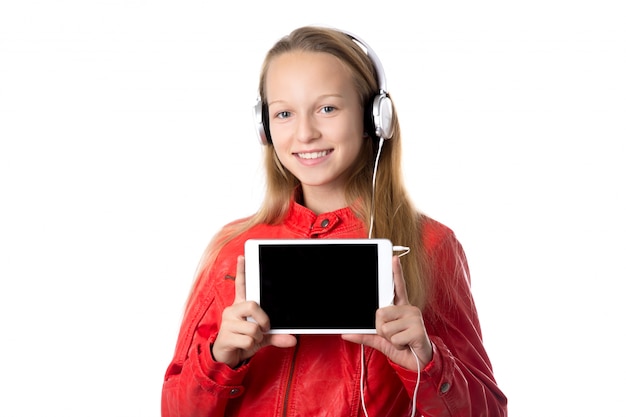 Girl with a tablet and headphones