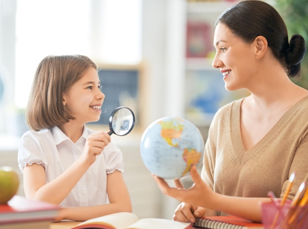 Girl with teacher in classroom