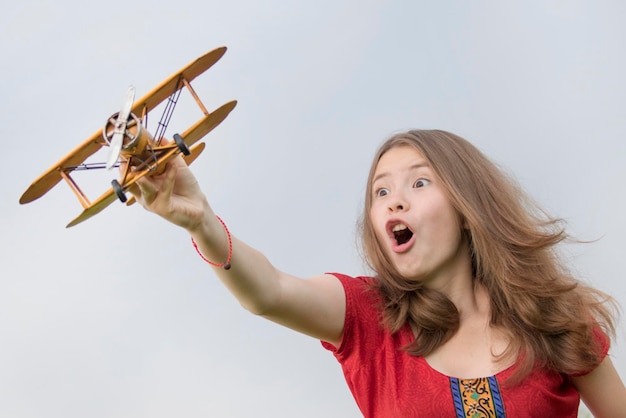 Girl with toy plane