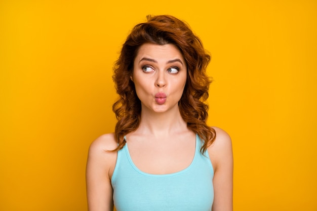 girl with trendy hairstyle isolated on orange