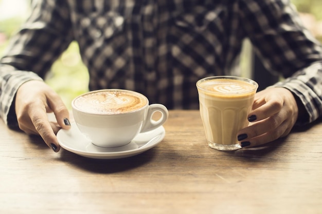 Girl with two cups of coffee