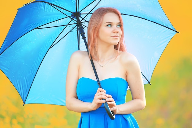 girl with an umbrella in a summer field of flowers, country female nature yellow field