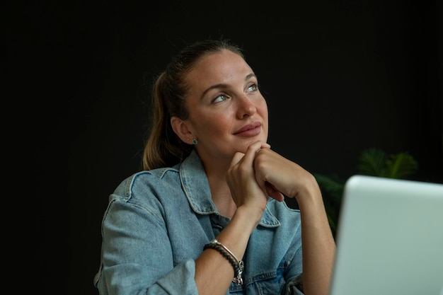 Girl working on laptop in trendy coffee shop stock photo