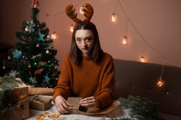 girl wrapping gifts for the new year