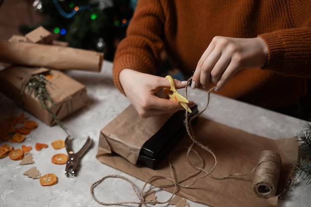 girl wrapping gifts for the new year