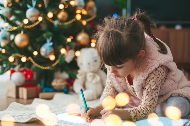 Girl writing a Christmas letter