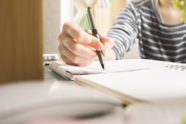 Girl writing in copybook