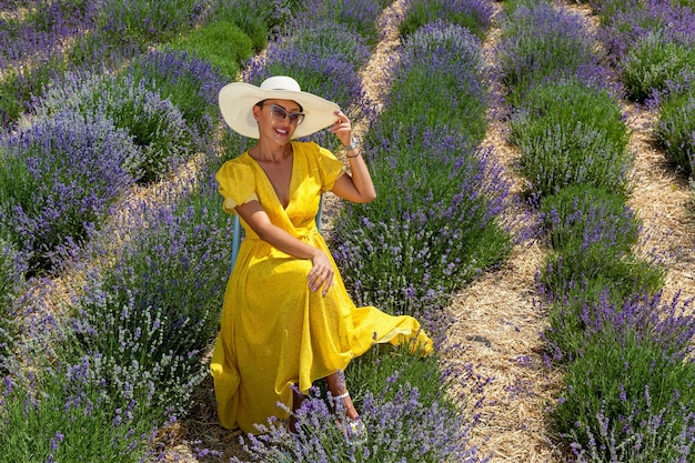 Girl in a yellow dress in a lavender field