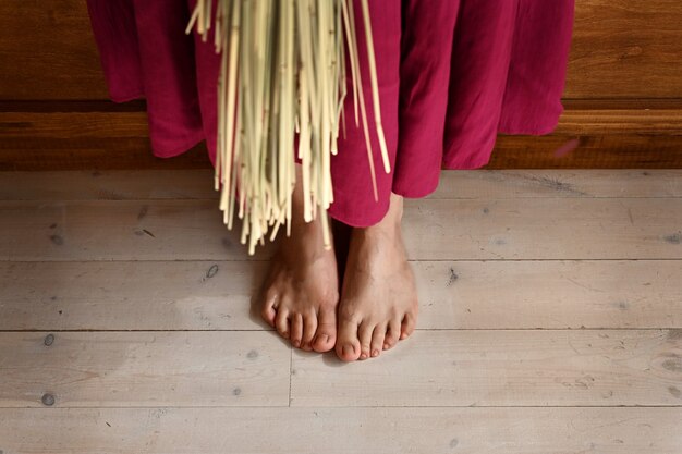 Girls feet on the wooden floor