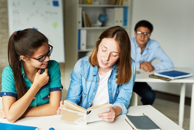 Girls Reading Book for Literature Class