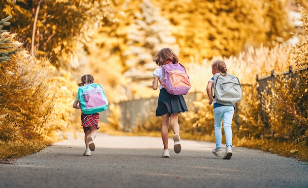 Girls with backpack are going to school