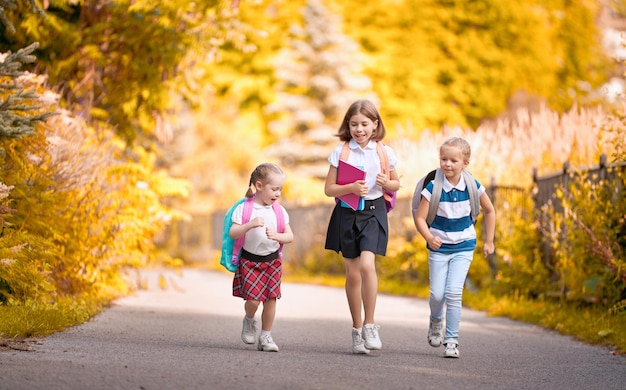 Girls with backpack are going to school