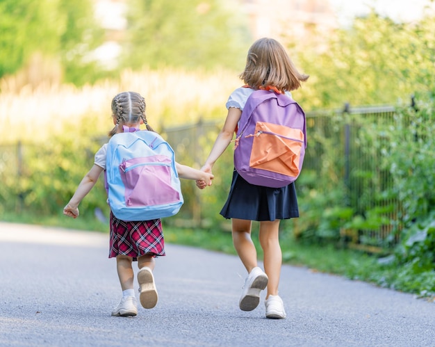 Girls with backpack are going to school