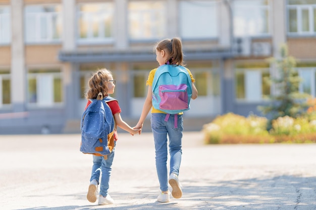 Girls with backpack are going to school