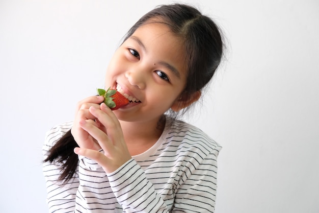 Girls with fresh red strawberries, healthy food