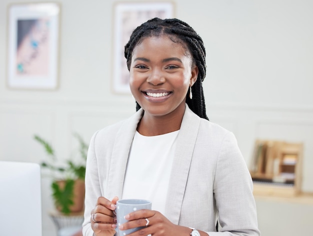 Give yourself a break. Shot of a beautiful young businesswoman enjoying a cup of coffee in her office.