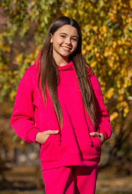 Glad teen child outdoor in autumn season