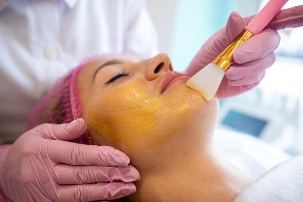 glamorous client came for a super golden mask procedure at an expensive salon in the city spa salon