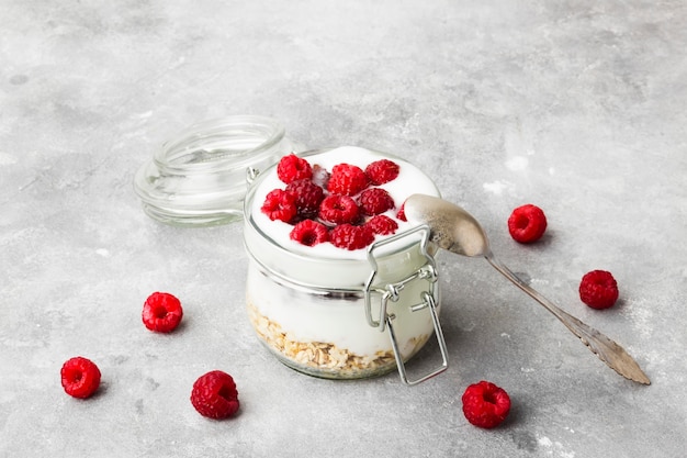 Glanola in glass jar with raspberry