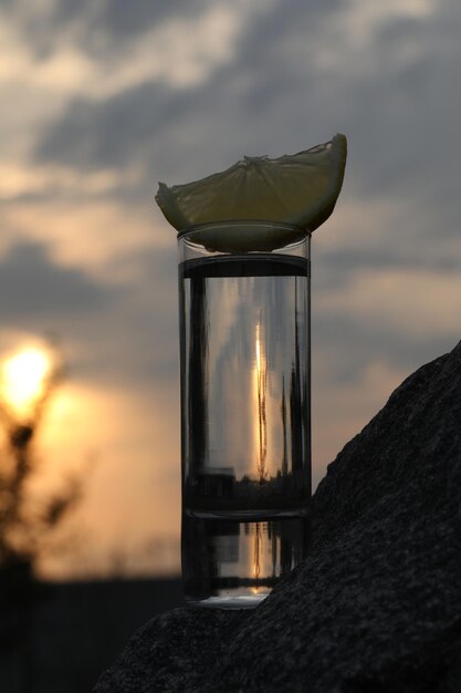 glass of alcohol drink with sky background