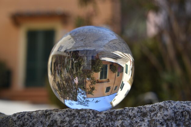 A glass ball with a house in the middle