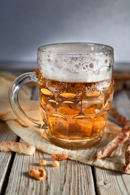 glass of beer craft beerbeer in mug mug of beer and snacks pretzel