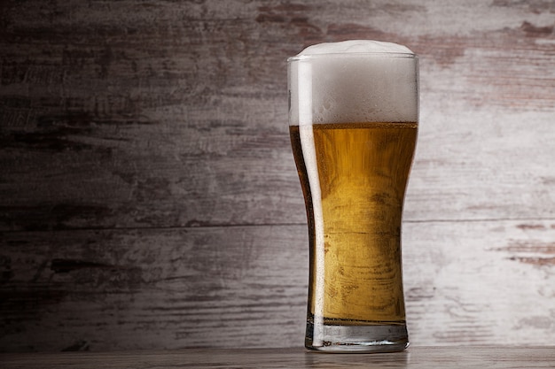 Glass of beer over grunge background