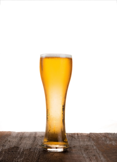 Glass of beer on white background