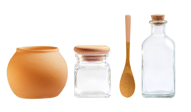 Glass bottles and ceramic utensils on a white background