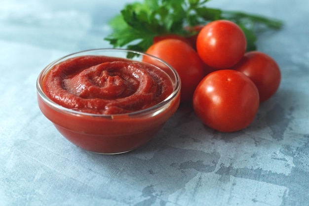 Glass bowl with tasty barbecue sauce on table