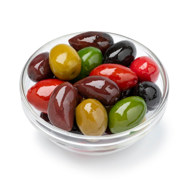 Glass bowl with a variation of different olives on white background