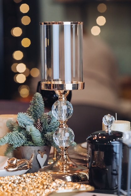 Glass candlestick on a New Year table